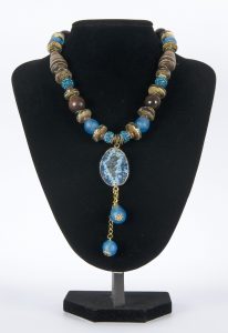 Necklace Light Blue with Round Blue pendant and two blue balls on buste