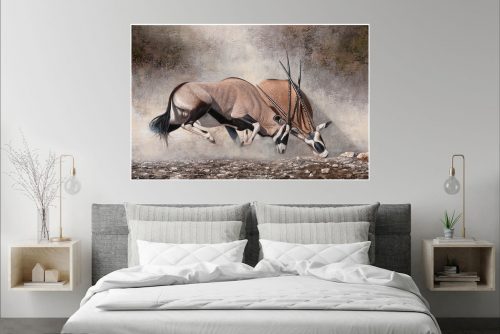 Clashing of horns over bed on light grey wall copy