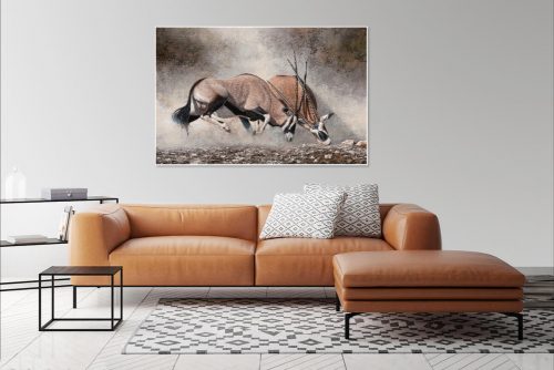Clashing of horns over brown couch on light wall copy