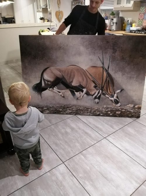 Danie Marais showing Clashing of horns to his youngest son Luka